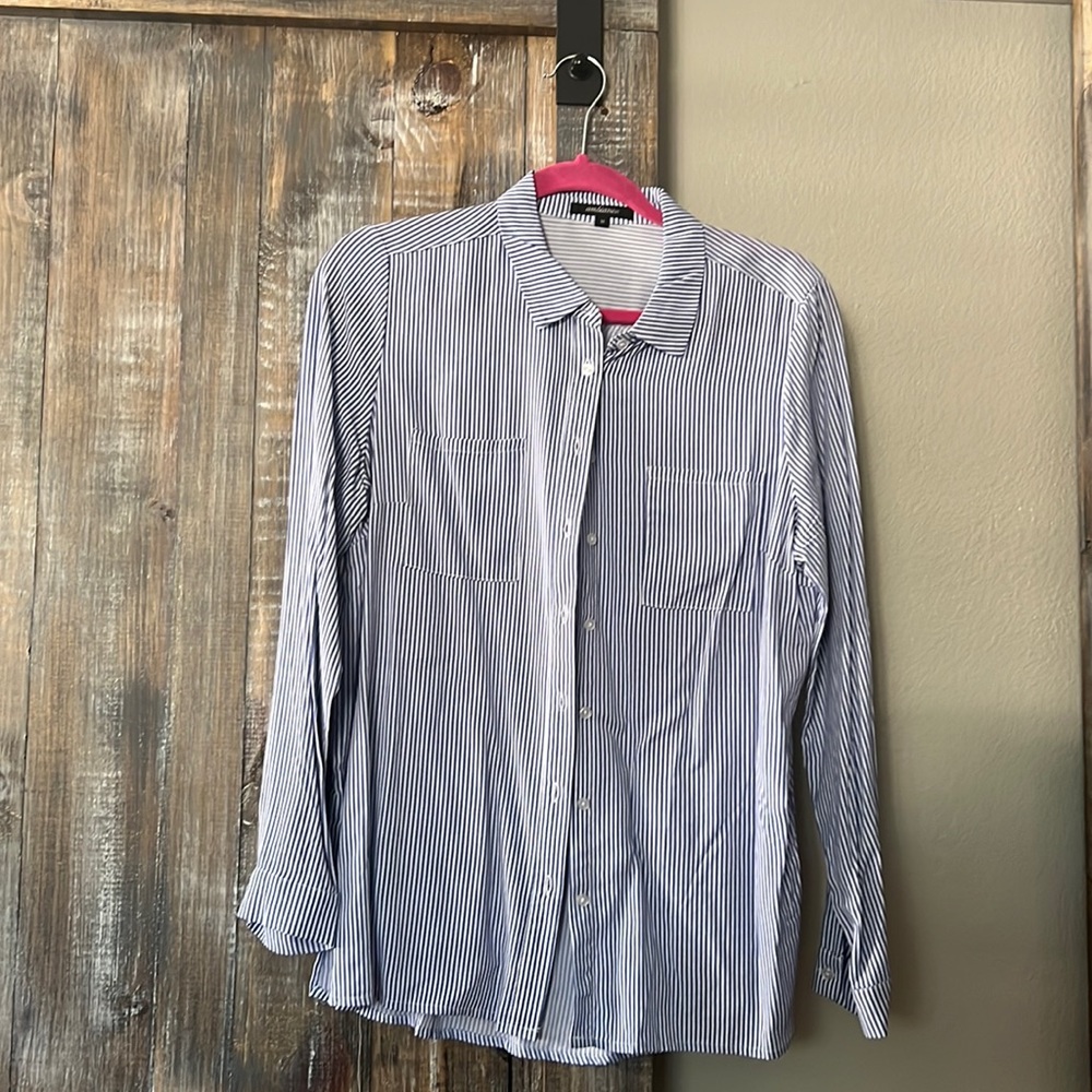 White and blue striped button up collared shirt